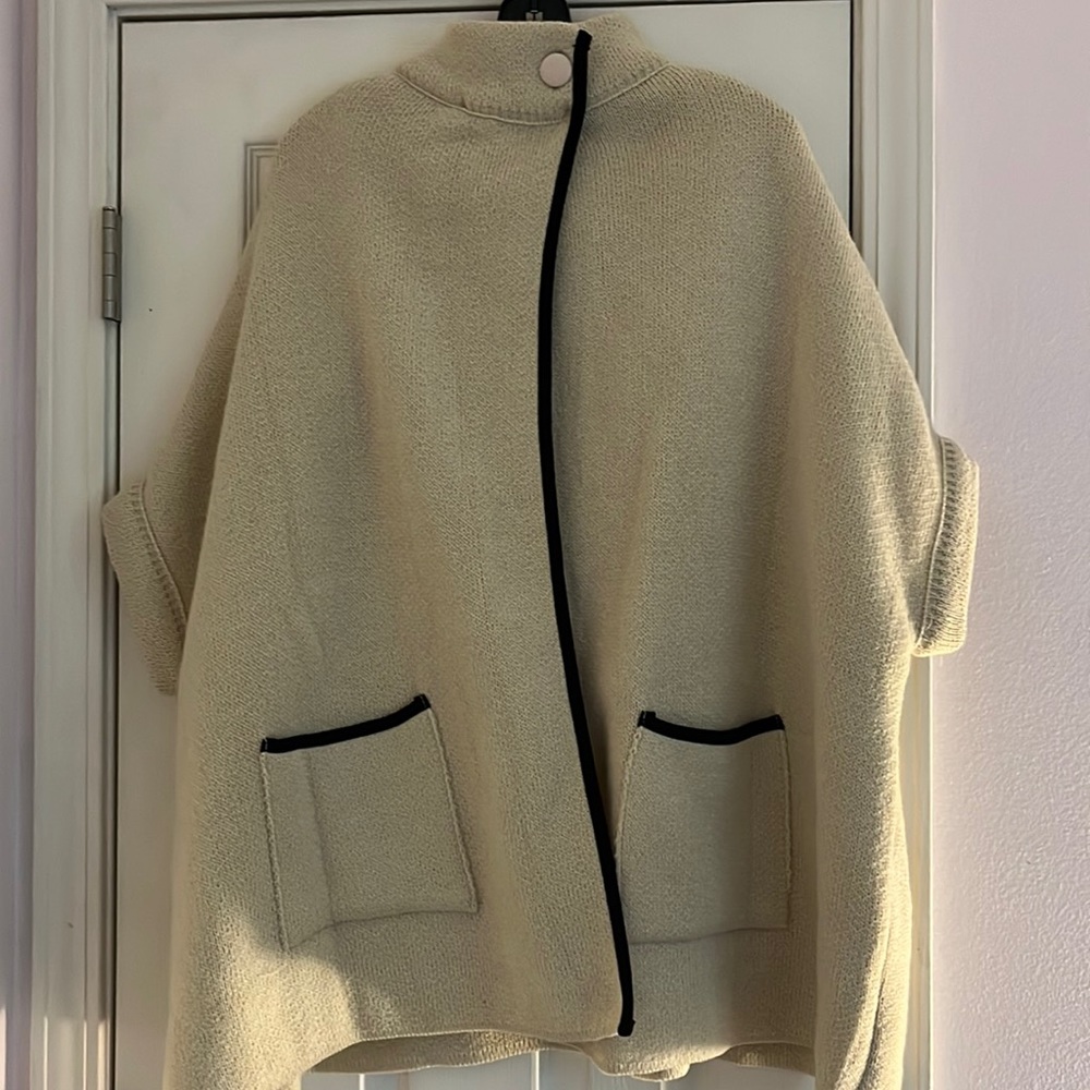 ONE SIZE cream color poncho with black detailing from LAUREN CONRAD.